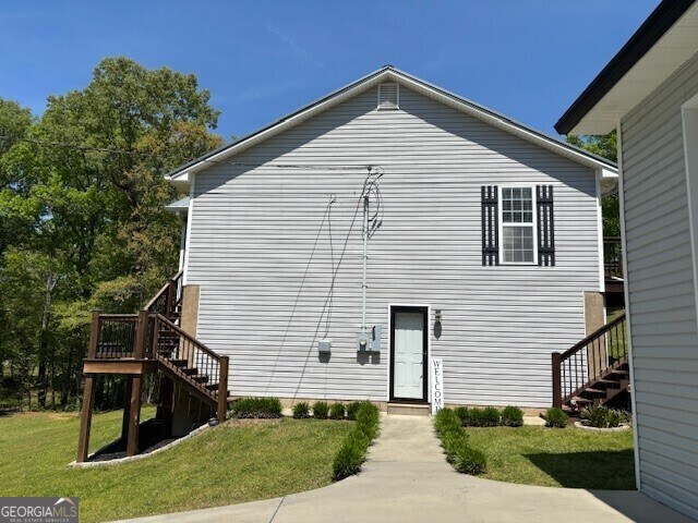 266 W Troutman Rd NE, Rome, GA 30165 - back of house with a yard, stairs, and a deck