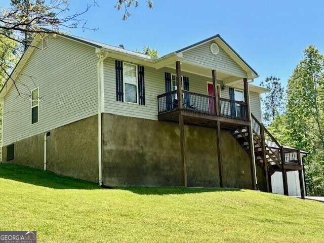 266 W Troutman Rd NE, Rome, GA 30165 - back of property featuring a lawn, stairway, and covered porch