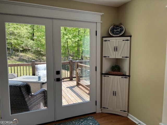 266 W Troutman Rd NE, Rome, GA 30165 - entryway featuring wood finished floors and french doors