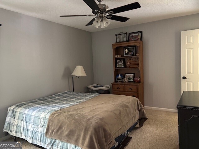 266 W Troutman Rd NE, Rome, GA 30165 - bedroom featuring light colored carpet, baseboards, and a ceiling fan