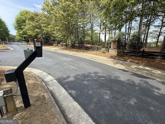 view of street featuring curbs and sidewalks