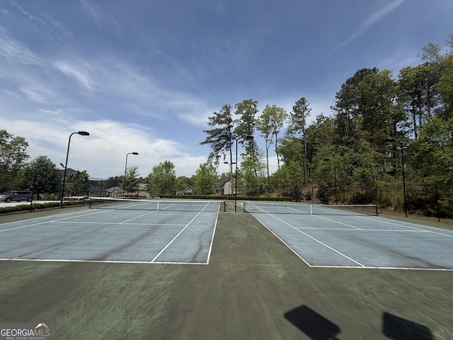 view of sport court featuring community basketball court and fence