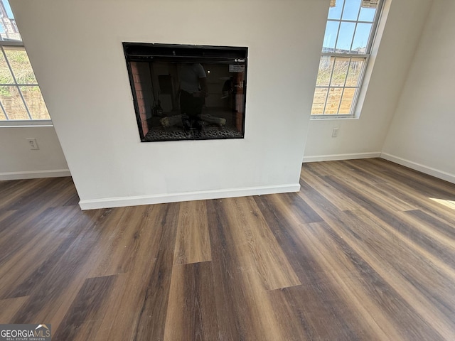 details featuring wood finished floors and baseboards