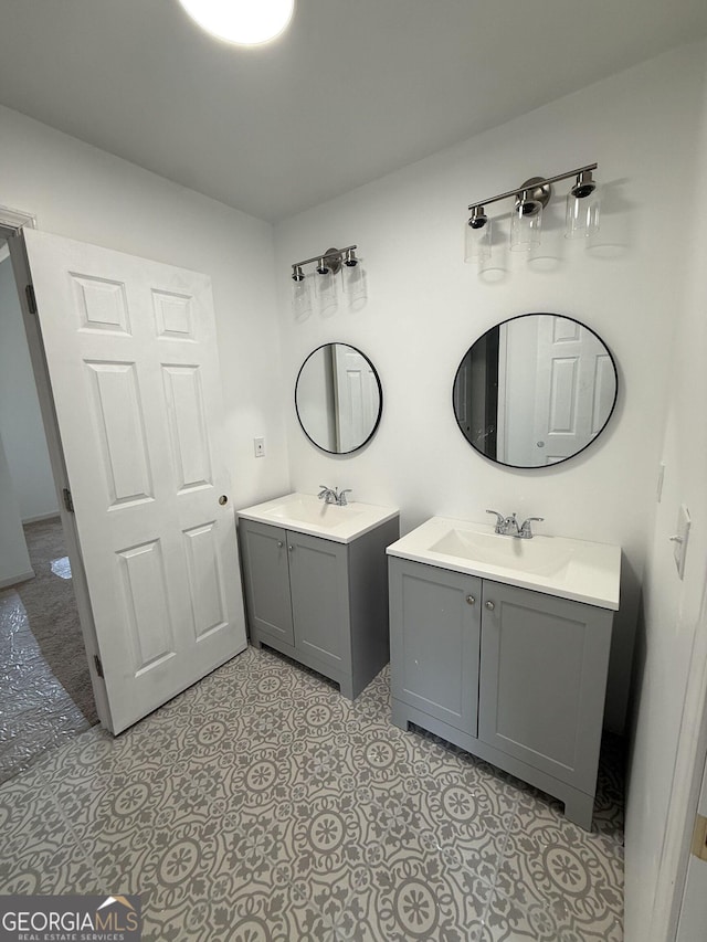 bathroom with two vanities and a sink