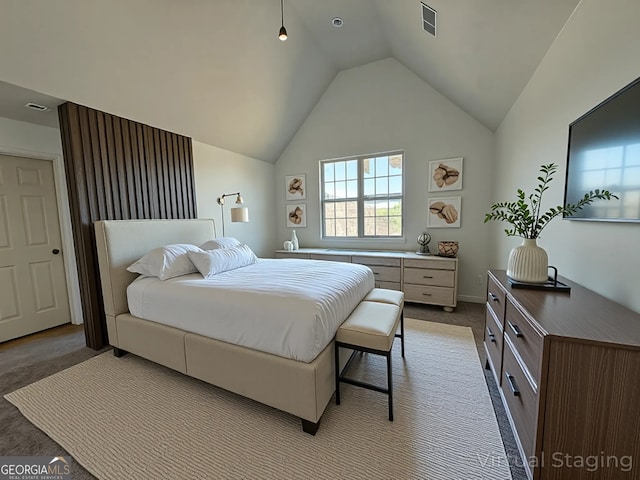 bedroom with lofted ceiling, visible vents, baseboards, and light carpet