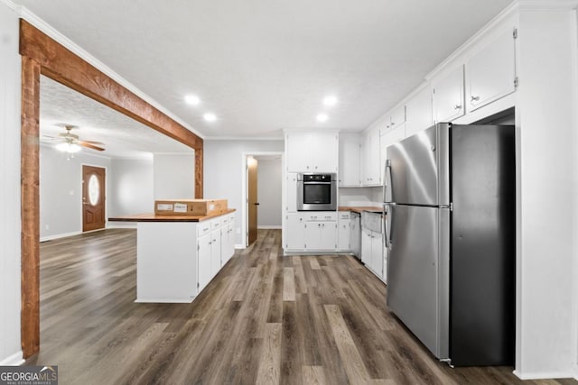 kitchen featuring recessed lighting, dark wood-type flooring, and stainless steel appliances