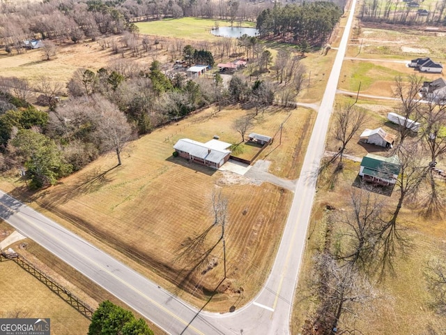 drone / aerial view with a water view and a rural view
