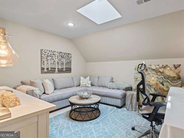 living room featuring lofted ceiling with skylight, visible vents, and recessed lighting