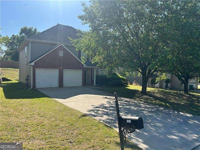 3334 Rockmill Dr, Ellenwood, GA 30294 - view of side of property featuring fence, a lawn, driveway, and a garage