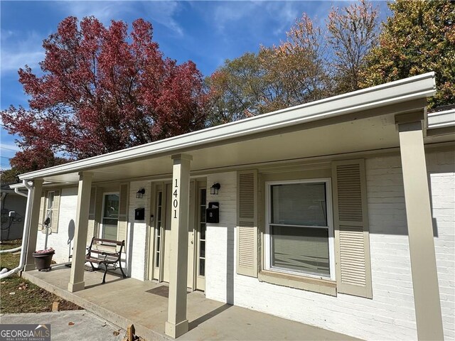1401 Vesta Ave, East Point, GA 30344 - exterior space with covered porch and brick siding