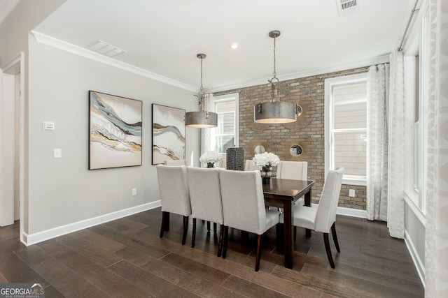 dining area with baseboards, crown molding, dark wood-style flooring, and visible vents