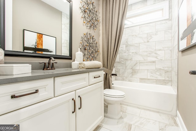 full bathroom featuring vanity, marble finish floor, baseboards, shower / tub combo, and toilet