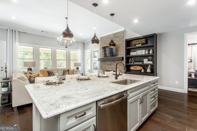 kitchen with dishwasher, open floor plan, dark wood-style flooring, and a sink