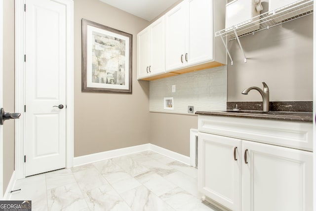 laundry room featuring hookup for a washing machine, a sink, electric dryer hookup, marble finish floor, and baseboards