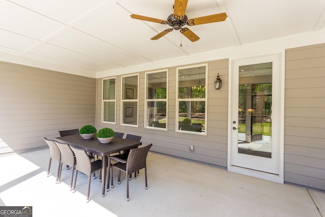 exterior space with outdoor dining area and ceiling fan