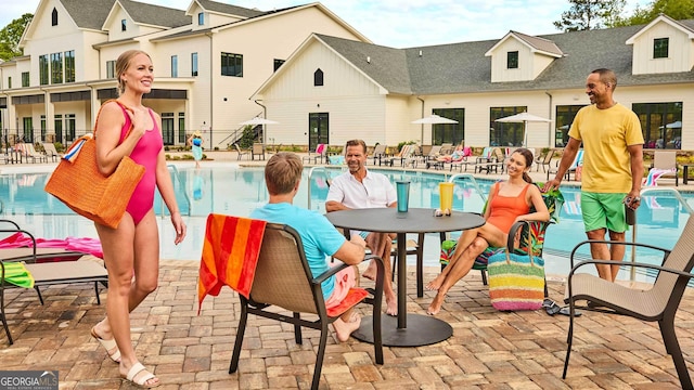 community pool featuring a patio area