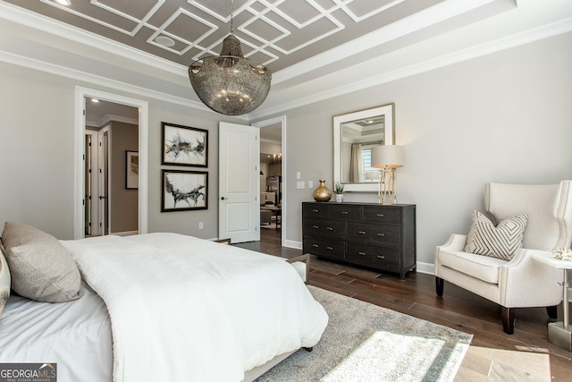 bedroom with a notable chandelier, a raised ceiling, baseboards, ornamental molding, and dark wood-type flooring
