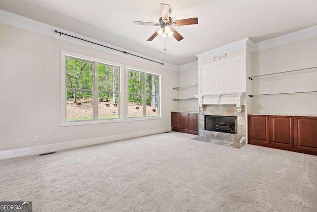 930 Riverside Rd, Roswell, GA 30075 - unfurnished living room with a high end fireplace, ceiling fan, crown molding, and carpet flooring