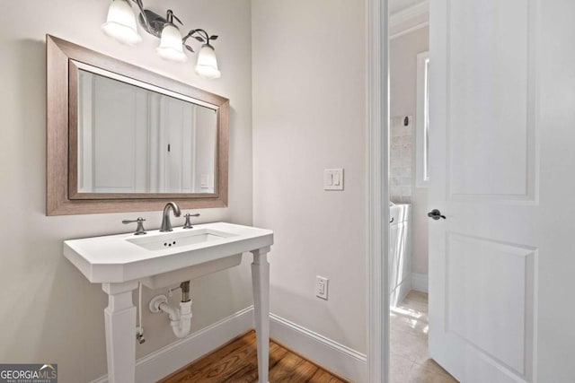 930 Riverside Rd, Roswell, GA 30075 - bathroom featuring baseboards and wood finished floors