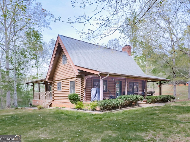 410 Whiskey Still Dr, Cleveland, GA 30528 - view of home's exterior featuring a chimney, log exterior, and a yard