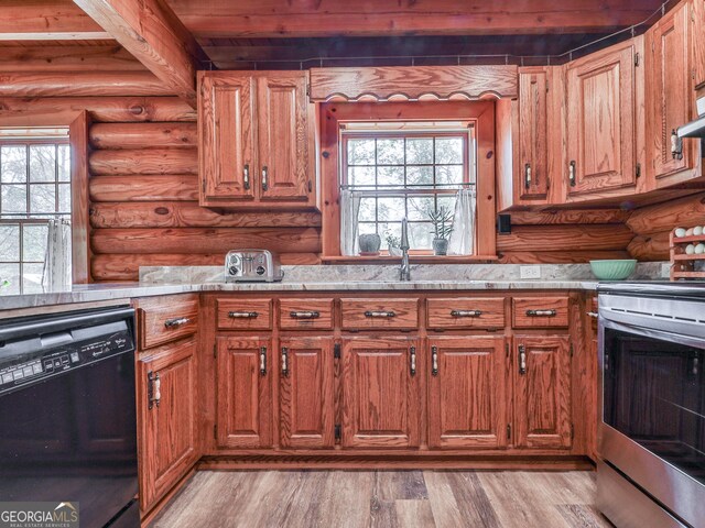 410 Whiskey Still Dr, Cleveland, GA 30528 - kitchen with electric stove, light countertops, rustic walls, and black dishwasher