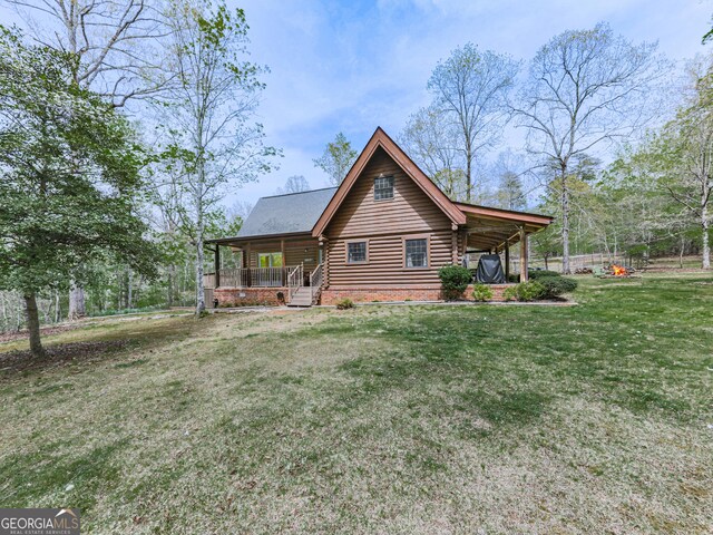 410 Whiskey Still Dr, Cleveland, GA 30528 - view of front facade with a front lawn, log exterior, and covered porch