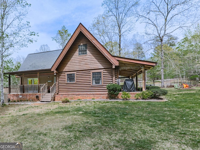 410 Whiskey Still Dr, Cleveland, GA 30528 - rear view of property featuring log exterior, a lawn, and a porch