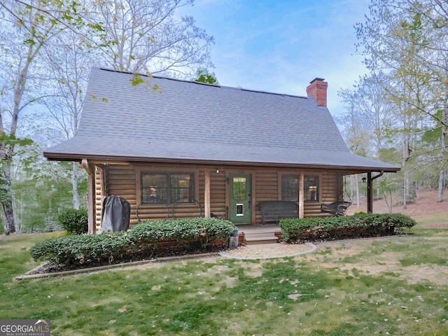 410 Whiskey Still Dr, Cleveland, GA 30528 - log home with covered porch, roof with shingles, a chimney, and log siding