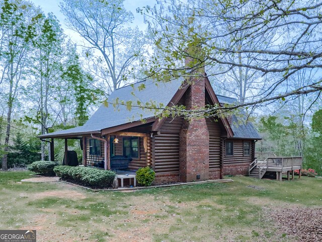 410 Whiskey Still Dr, Cleveland, GA 30528 - view of side of property featuring a chimney, a deck, a shingled roof, a yard, and log exterior
