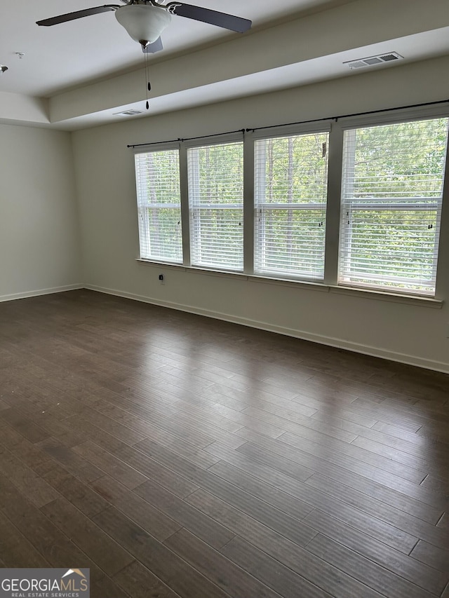 3908 Augustine Pl, Rex, GA 30273 - unfurnished room featuring dark wood finished floors, baseboards, a ceiling fan, and visible vents