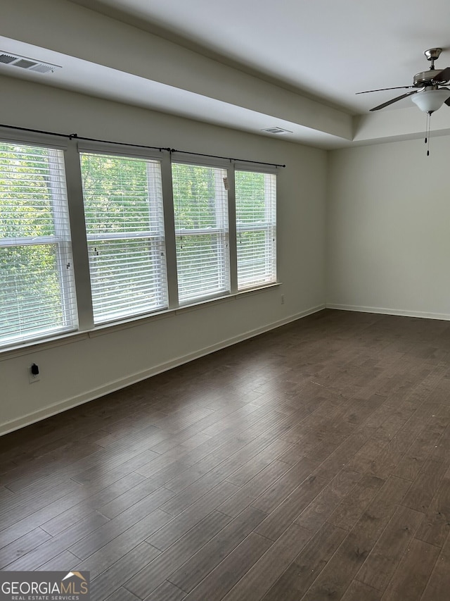 3908 Augustine Pl, Rex, GA 30273 - unfurnished room featuring baseboards, a ceiling fan, visible vents, and dark wood-style floors