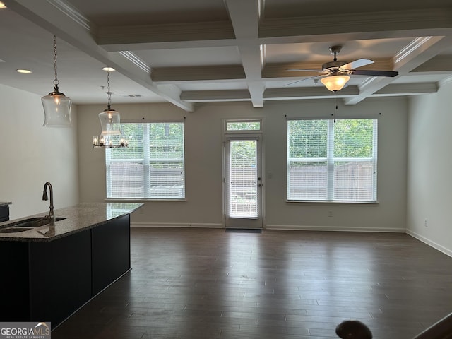 3908 Augustine Pl, Rex, GA 30273 - unfurnished living room with beamed ceiling, a wealth of natural light, a sink, and coffered ceiling