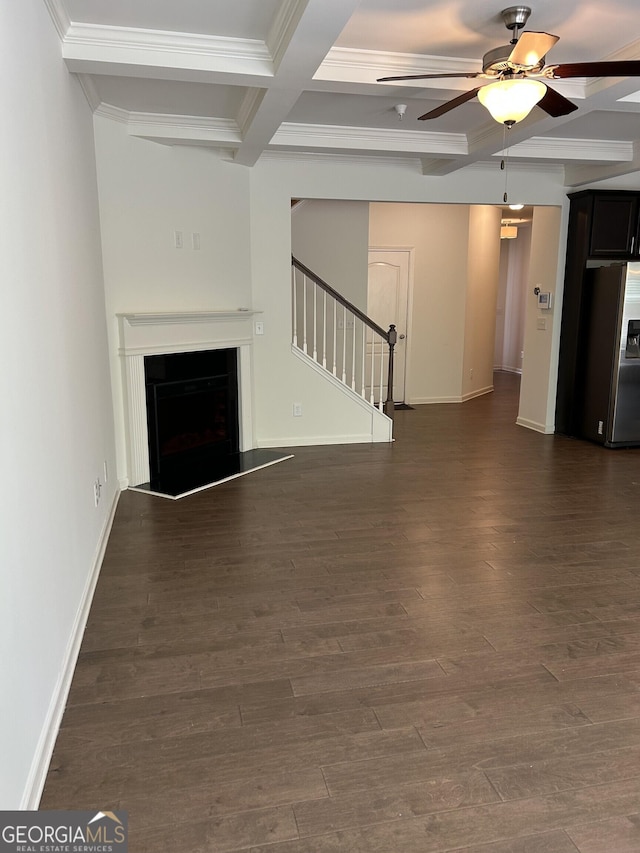 3908 Augustine Pl, Rex, GA 30273 - unfurnished living room featuring stairway, a fireplace with raised hearth, a ceiling fan, beam ceiling, and dark wood-style flooring