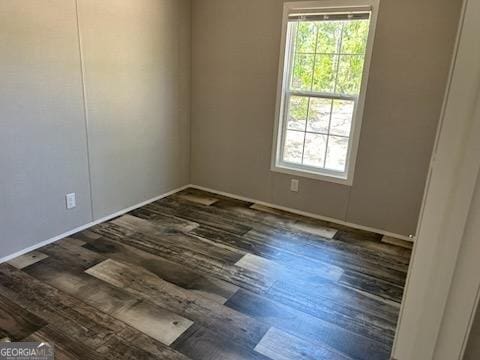 908 Bethel Freewill Rd, Baxley, GA 31513 - empty room with wood finished floors and baseboards