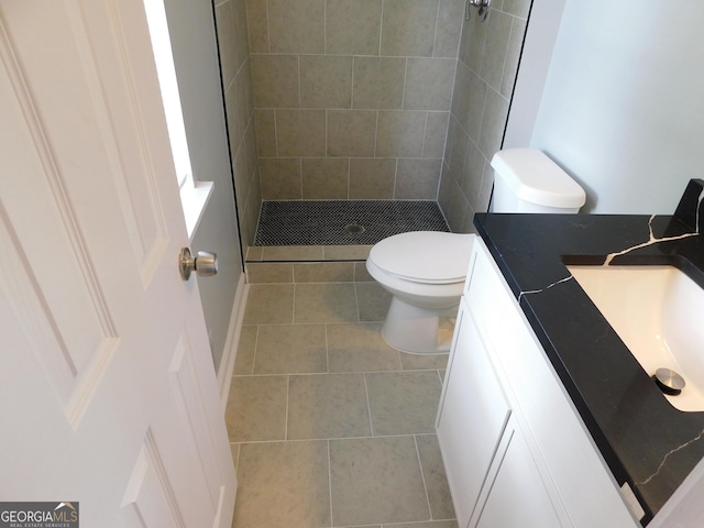 full bath featuring a shower stall, toilet, tile patterned flooring, and vanity