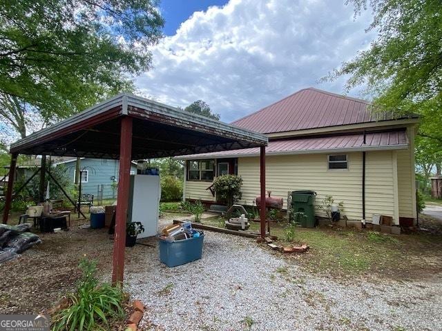 exterior space with a carport