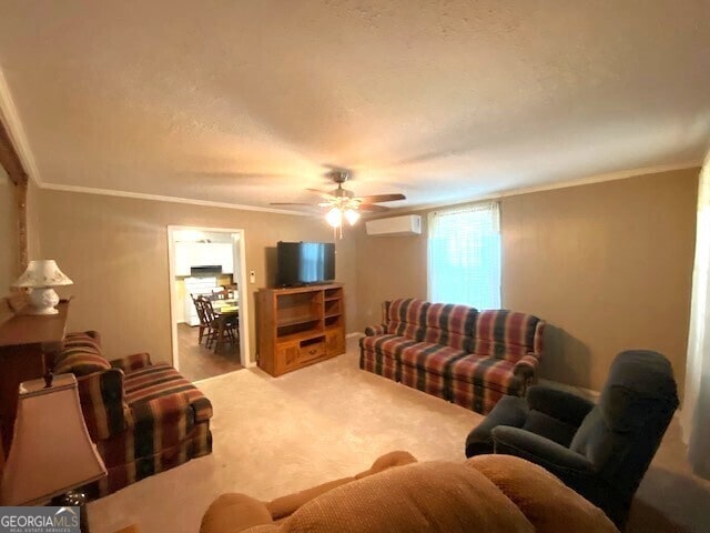 living room with carpet flooring, crown molding, ceiling fan, and a wall mounted air conditioner