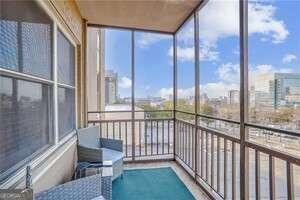 300 Peachtree St NE Unit 5A, Atlanta, GA 30308 - sunroom with a wall of windows