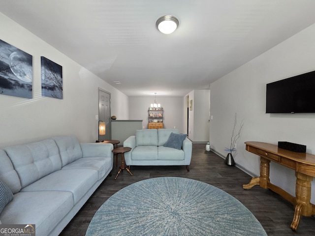 3202 Fairington Village Dr, Lithonia, GA 30038 - living room with an inviting chandelier, wood finished floors, and baseboards