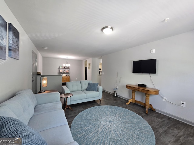 3202 Fairington Village Dr, Lithonia, GA 30038 - living area featuring an inviting chandelier, dark wood-type flooring, and baseboards