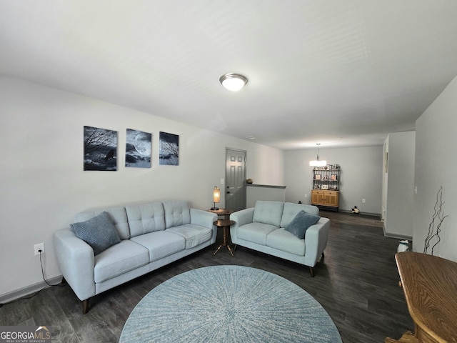 3202 Fairington Village Dr, Lithonia, GA 30038 - living area featuring a chandelier, baseboards, and dark wood-style floors