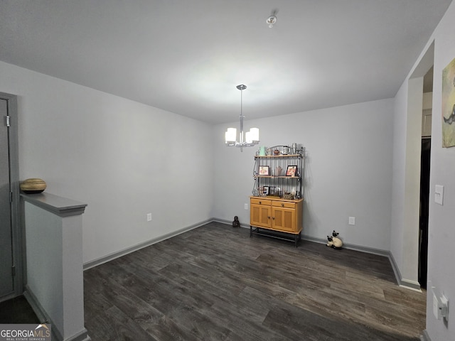 3202 Fairington Village Dr, Lithonia, GA 30038 - dining room featuring baseboards, dark wood-style floors, and a chandelier