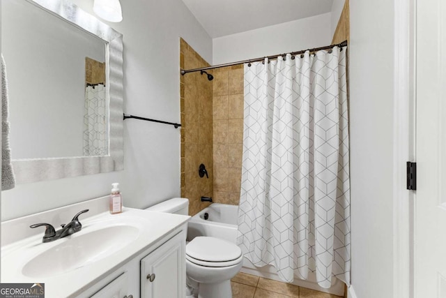 full bath featuring shower / tub combo with curtain, toilet, vanity, and tile patterned floors