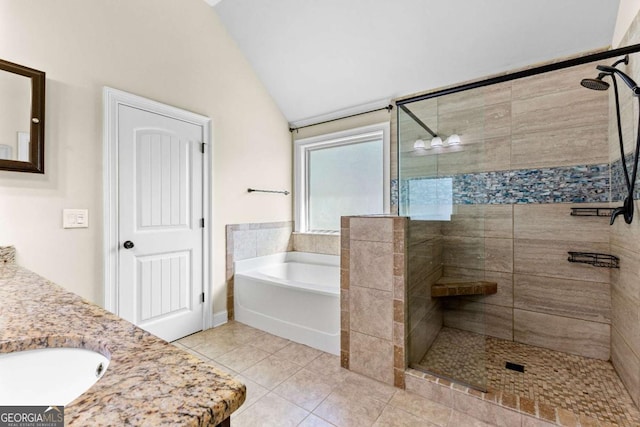bathroom featuring a shower stall, vaulted ceiling, tile patterned flooring, and a bath