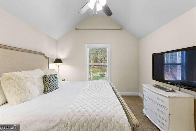 carpeted bedroom featuring ceiling fan, vaulted ceiling, and baseboards