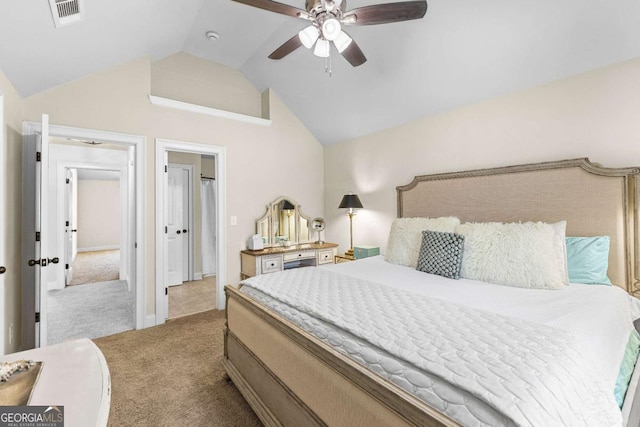 bedroom with vaulted ceiling, ceiling fan, baseboards, carpet flooring, and visible vents