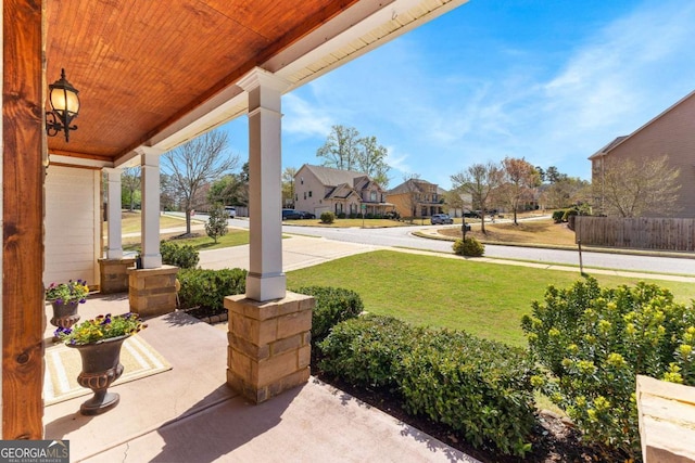 view of patio with a residential view and a porch