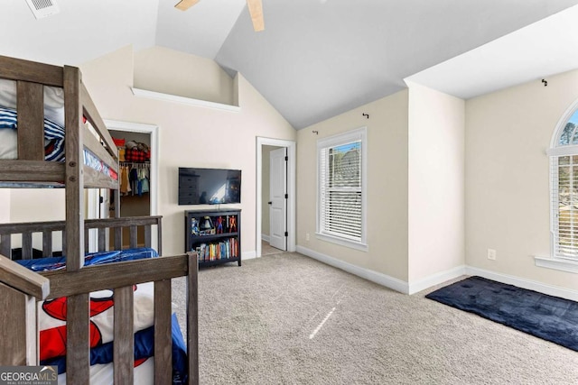 bedroom with vaulted ceiling, baseboards, visible vents, a ceiling fan, and carpet floors