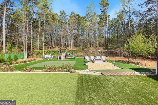 surrounding community featuring a yard and a playground