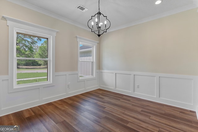 88 Northshore Ave, Jesup, GA 31545 - unfurnished dining area with crown molding, wainscoting, dark wood finished floors, a notable chandelier, and visible vents